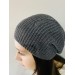 Thin knitted beanie hat with a pattern of dropped loops that create a "hole effect". merino wool and polyamide